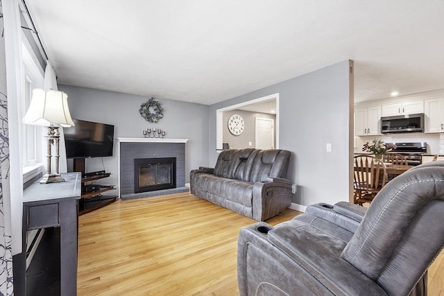 30 Millham St, Marlborough, MA 01752 - living room featuring wood finished floors and a fireplace