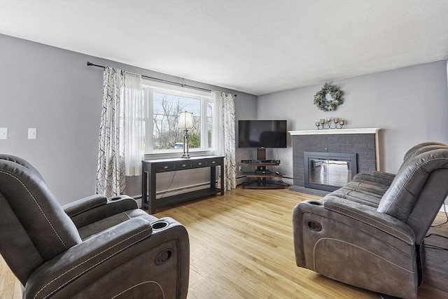 30 Millham St, Marlborough, MA 01752 - living area with wood finished floors and a fireplace