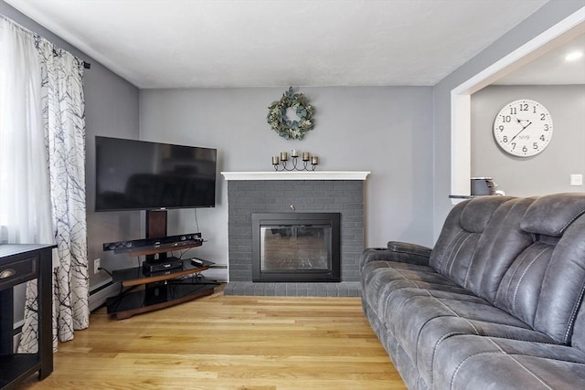 30 Millham St, Marlborough, MA 01752 - living room featuring wood finished floors and a brick fireplace