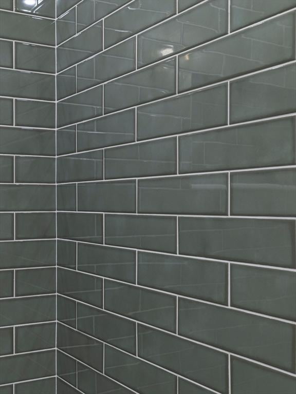 room details with a tile shower