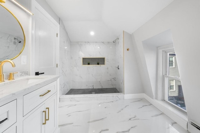 bathroom with vanity, a baseboard heating unit, and tiled shower