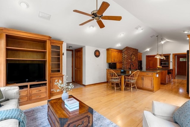 75 Haynes Rd, Sudbury, MA 01776 - living room with vaulted ceiling, ceiling fan, light wood-type flooring, and baseboards