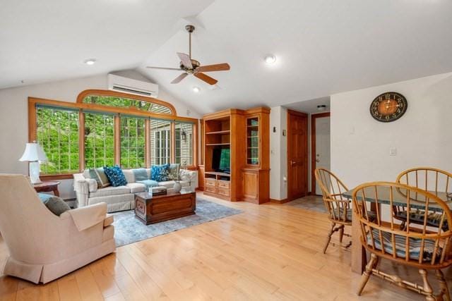 75 Haynes Rd, Sudbury, MA 01776 - living room featuring a wall mounted air conditioner, ceiling fan, light wood finished floors, and lofted ceiling