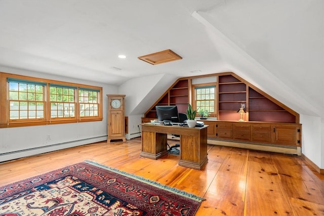 75 Haynes Rd, Sudbury, MA 01776 - office space featuring a baseboard heating unit, built in features, vaulted ceiling, healthy amount of natural light, and light wood-style flooring