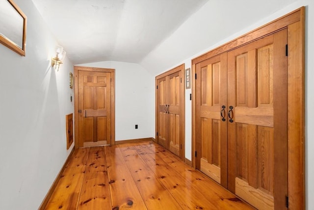 75 Haynes Rd, Sudbury, MA 01776 - corridor with vaulted ceiling, light wood finished floors, and baseboards