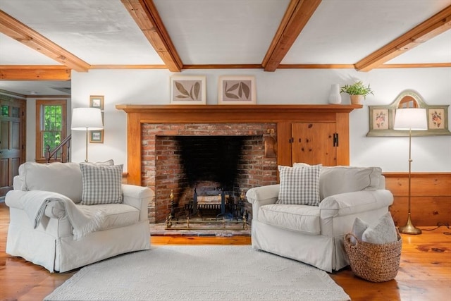 75 Haynes Rd, Sudbury, MA 01776 - living room featuring wood finished floors, beam ceiling, and a fireplace