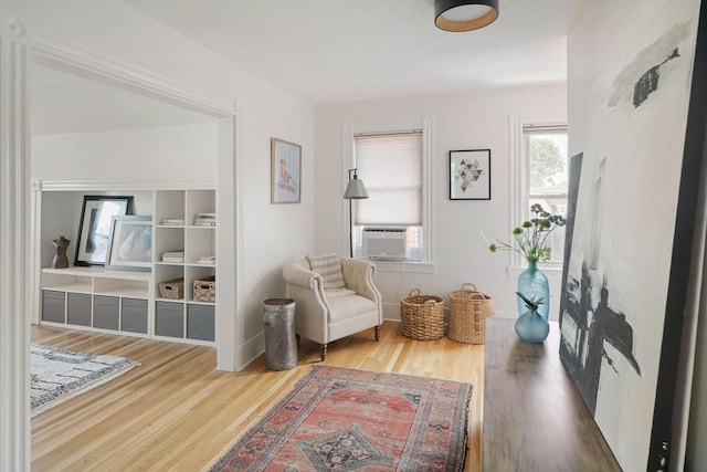 22 Robinson Unit 3, Somerville, MA 02145 - sitting room with cooling unit and wood finished floors