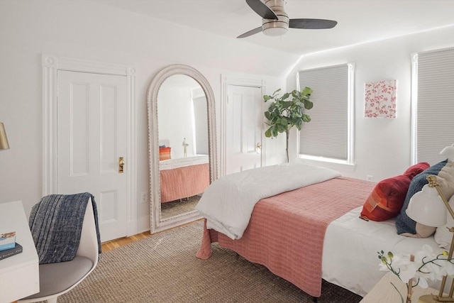 22 Robinson Unit 3, Somerville, MA 02145 - bedroom with light wood-style flooring, vaulted ceiling, and a ceiling fan