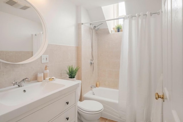 22 Robinson Unit 3, Somerville, MA 02145 - full bathroom featuring shower / bath combo, vanity, and tile walls