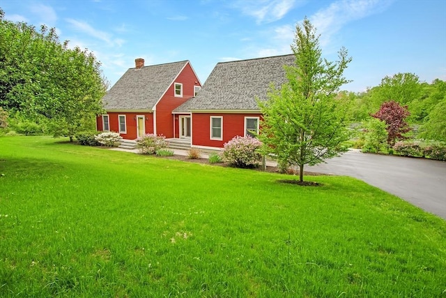 144 Worcester Rd, New Braintree, MA 01531 - cape cod home featuring a chimney, a front yard, and asphalt driveway