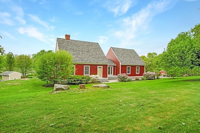 144 Worcester Rd, New Braintree, MA 01531 - rear view of house with a chimney and a yard