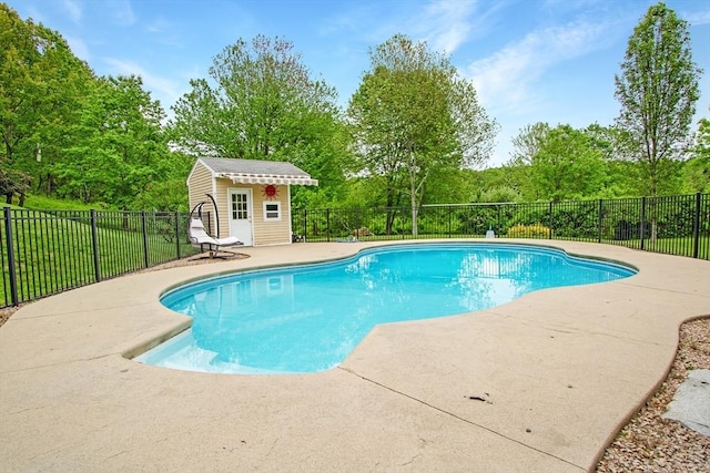 144 Worcester Rd, New Braintree, MA 01531 - view of pool with a patio area, an outdoor structure, and view of wooded area