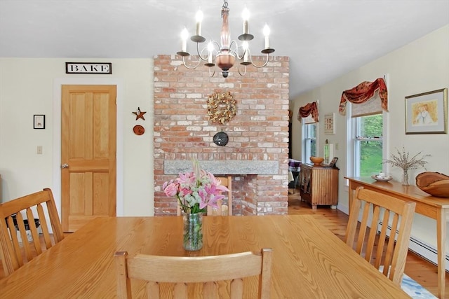144 Worcester Rd, New Braintree, MA 01531 - dining area with a chandelier and wood finished floors