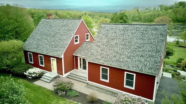 144 Worcester Rd, New Braintree, MA 01531 - view of front of property featuring roof with shingles, a chimney, and a forest view