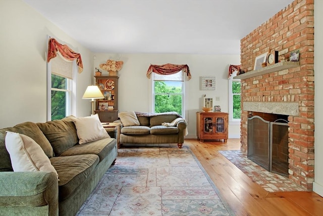 144 Worcester Rd, New Braintree, MA 01531 - living room with light wood finished floors and a brick fireplace