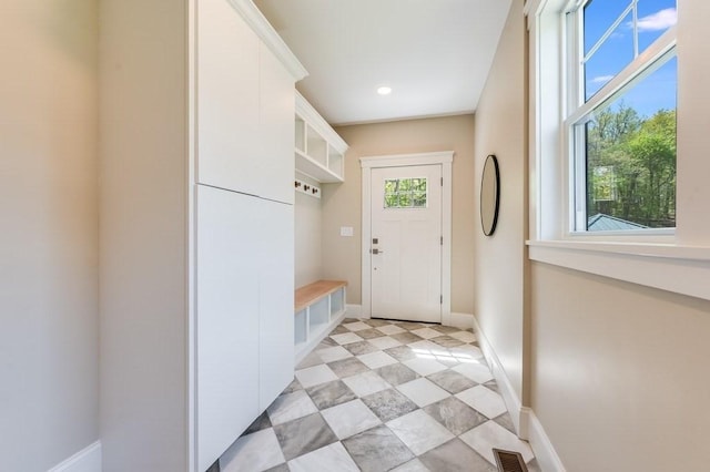 mudroom featuring light tile patterned floors, baseboards, recessed lighting, and visible vents