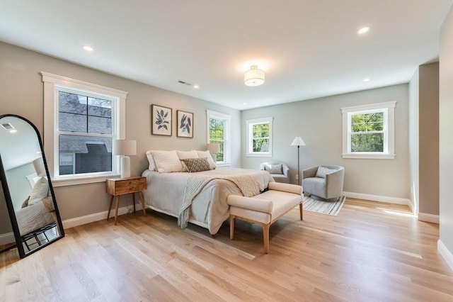 bedroom with recessed lighting, baseboards, visible vents, and light wood finished floors