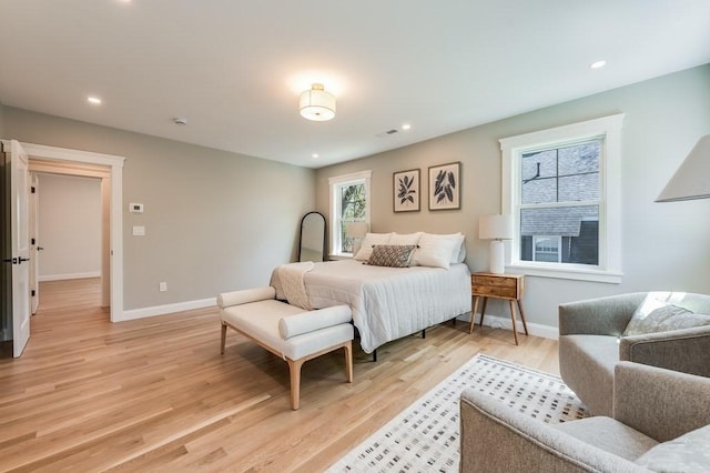 bedroom featuring recessed lighting, baseboards, visible vents, and light wood finished floors