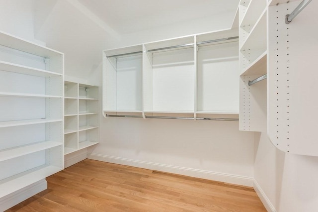 walk in closet featuring light wood finished floors