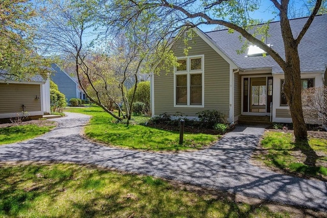 7 Brewster Ln Unit 7, Acton, MA 01720 - exterior space featuring a lawn and a shingled roof