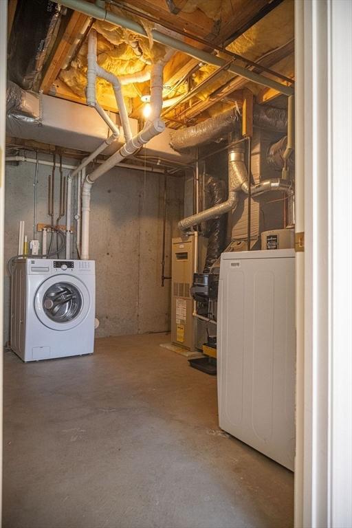 7 Brewster Ln Unit 7, Acton, MA 01720 - unfinished basement featuring washer and clothes dryer