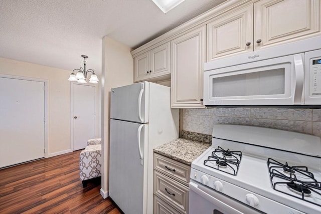 kitchen featuring pendant lighting, tasteful backsplash, dark wood-style floors, a chandelier, and white appliances