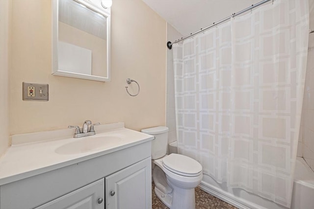 full bathroom with vanity, shower / bath combo with shower curtain, and toilet