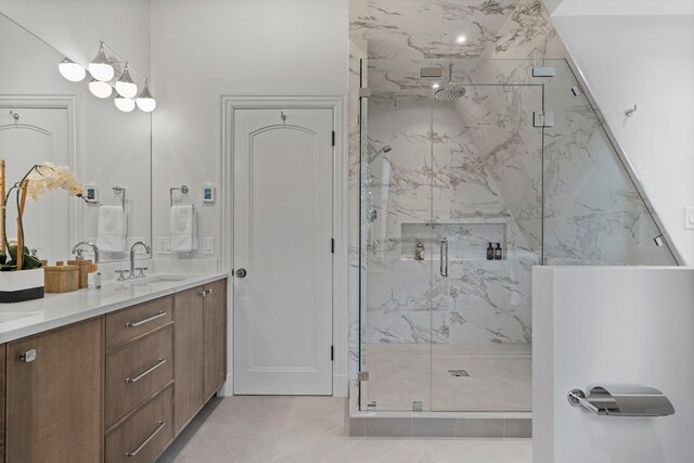 bathroom with vanity, tile patterned flooring, and walk in shower