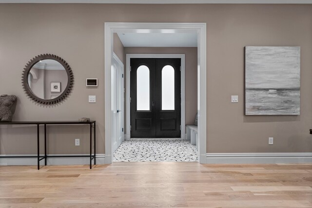 foyer featuring tile patterned flooring