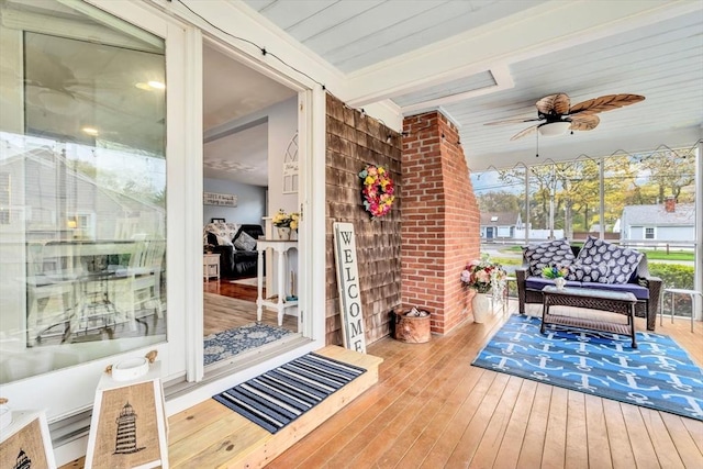 deck featuring a ceiling fan and covered porch