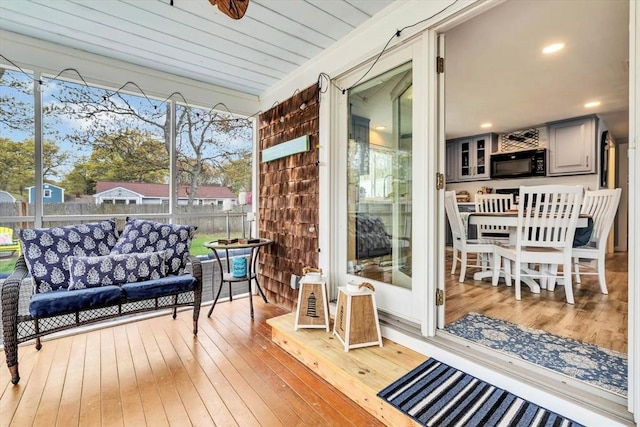sunroom / solarium with outdoor lounge area