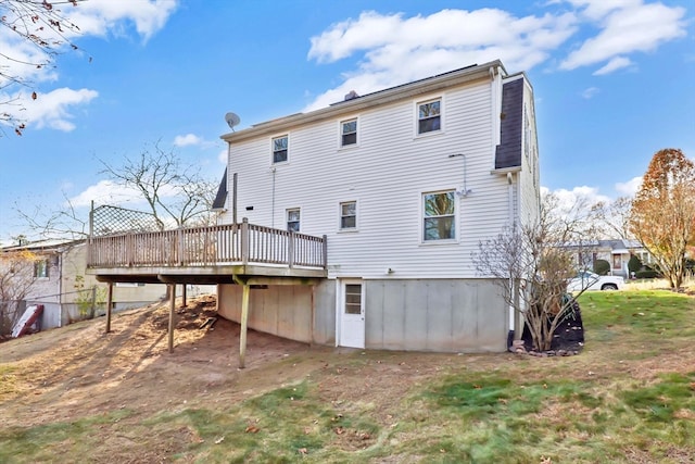 rear view of house with a wooden deck