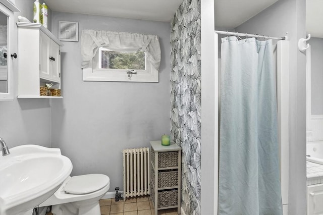 2 Putnam Ln, Auburn, MA 01501 - bathroom with radiator heating unit, tile patterned flooring, and a shower with curtain