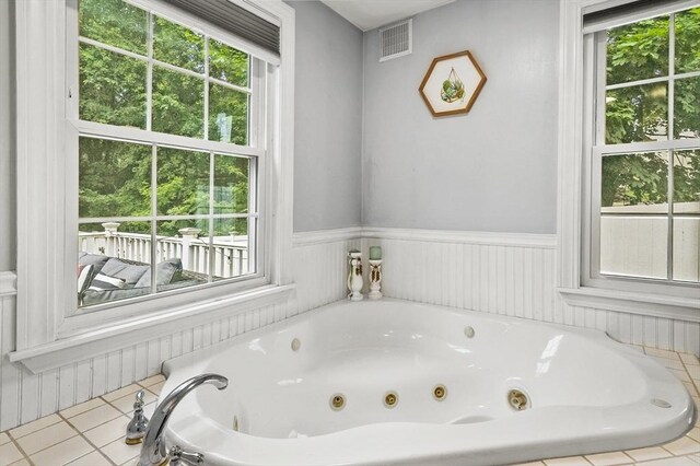 2 Putnam Ln, Auburn, MA 01501 - bathroom featuring a whirlpool tub, plenty of natural light, wainscoting, and tile patterned floors