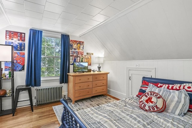 2 Putnam Ln, Auburn, MA 01501 - bedroom with radiator, vaulted ceiling, and wood finished floors