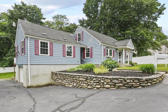 2 Putnam Ln, Auburn, MA 01501 - view of front of property with a chimney, a shingled roof, a garage, and a patio