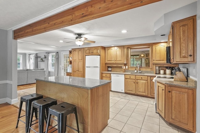 2 Putnam Ln, Auburn, MA 01501 - kitchen featuring white appliances, a breakfast bar, a kitchen island, dark stone countertops, and recessed lighting