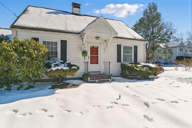 view of front of house with a chimney