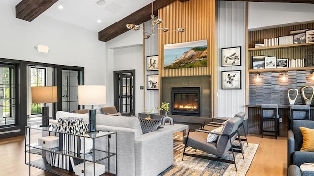 11 Juniper Ln Unit 14, Tyngsborough, MA 01879 - living room featuring high vaulted ceiling, wood finished floors, beam ceiling, and a fireplace