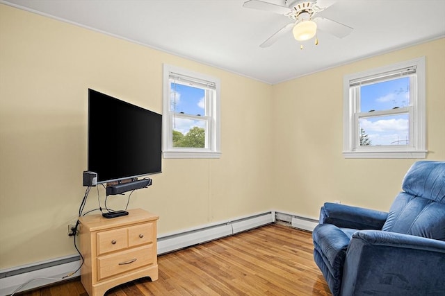 3 Manomet Rd, Woburn, MA 01801 - living area featuring a baseboard radiator, a baseboard heating unit, light wood-style flooring, and ceiling fan