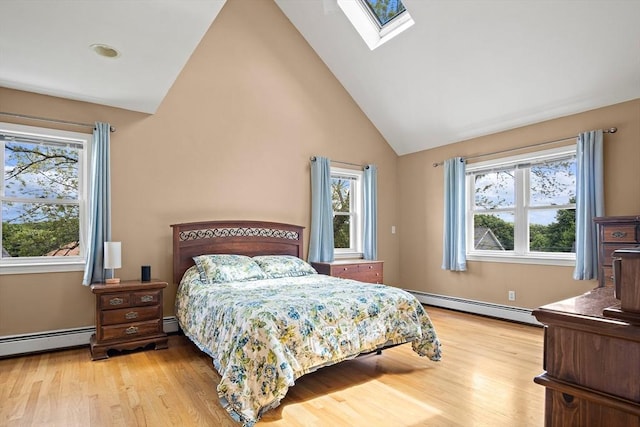 3 Manomet Rd, Woburn, MA 01801 - bedroom featuring light wood-style flooring, a skylight, baseboard heating, and high vaulted ceiling
