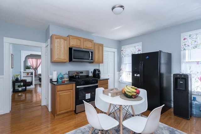 30-32 Loxwood St, Worcester, MA 01604 - kitchen featuring appliances with stainless steel finishes, light wood finished floors, and dark countertops