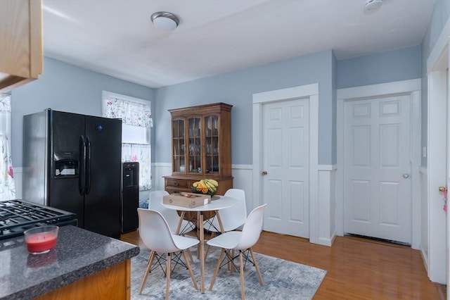 30-32 Loxwood St, Worcester, MA 01604 - dining area with wainscoting and light wood-style flooring