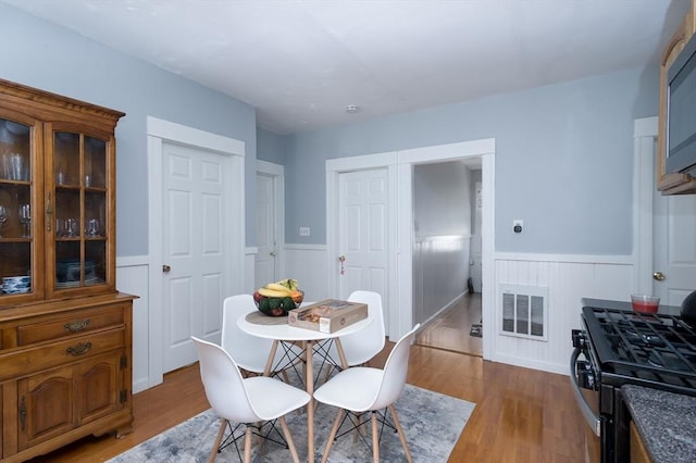30-32 Loxwood St, Worcester, MA 01604 - dining space featuring wainscoting and wood finished floors