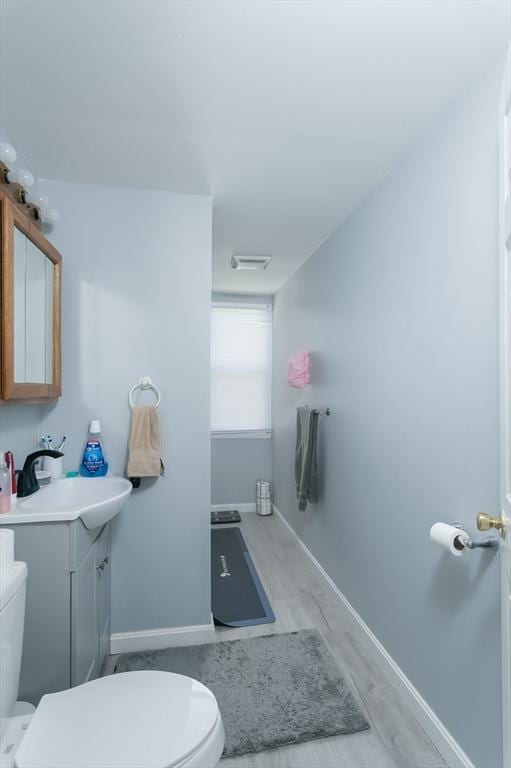 30-32 Loxwood St, Worcester, MA 01604 - bathroom featuring toilet, vanity, and baseboards