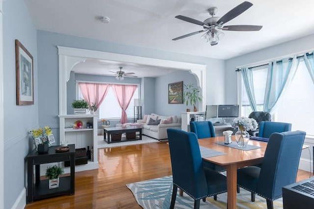 30-32 Loxwood St, Worcester, MA 01604 - dining room featuring ceiling fan, healthy amount of natural light, wood finished floors, and arched walkways