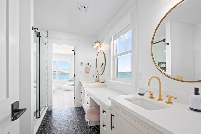 full bathroom with a shower stall, two vanities, visible vents, and a sink