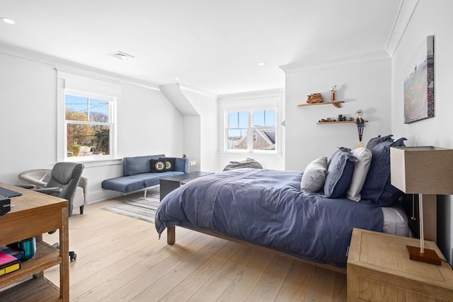 bedroom with crown molding, multiple windows, recessed lighting, and light wood finished floors