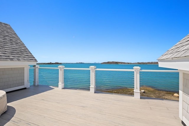 wooden deck with a water view