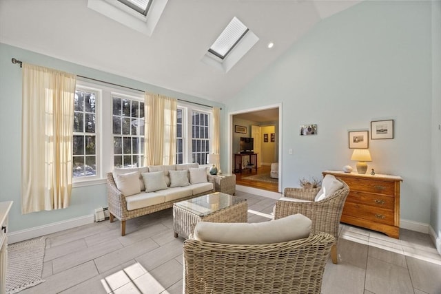 living room with high vaulted ceiling, a skylight, a baseboard heating unit, and baseboards